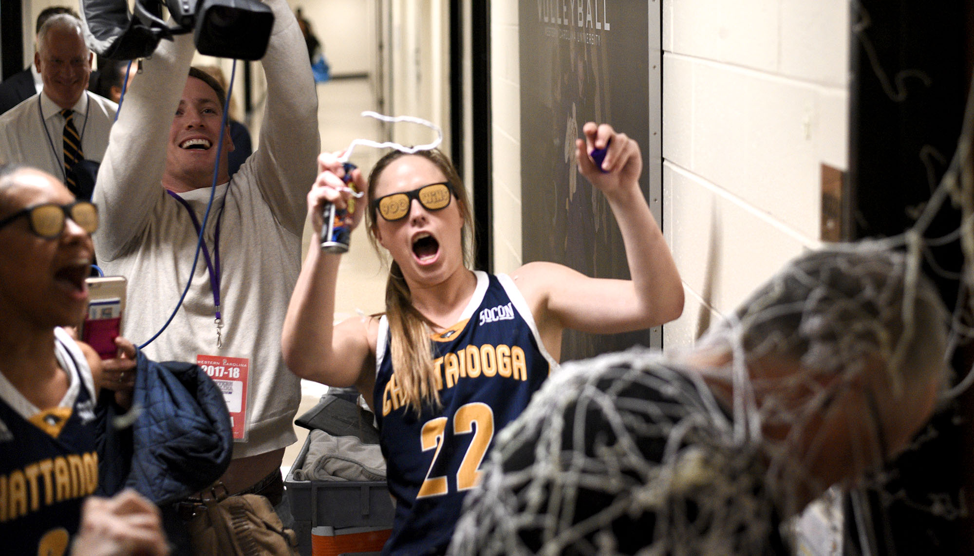 Chattanooga's Shelbie Davenport (22) empties the last of her silly string as she and her teammates covered head coach Jim Foster after his 900th win. The University of Tennessee Mocs visited the Western Carolina Catamounts in Southern Conference women's basketball action at the Ramsey Center in Cullowhee, North Carolina on February 1, 2018