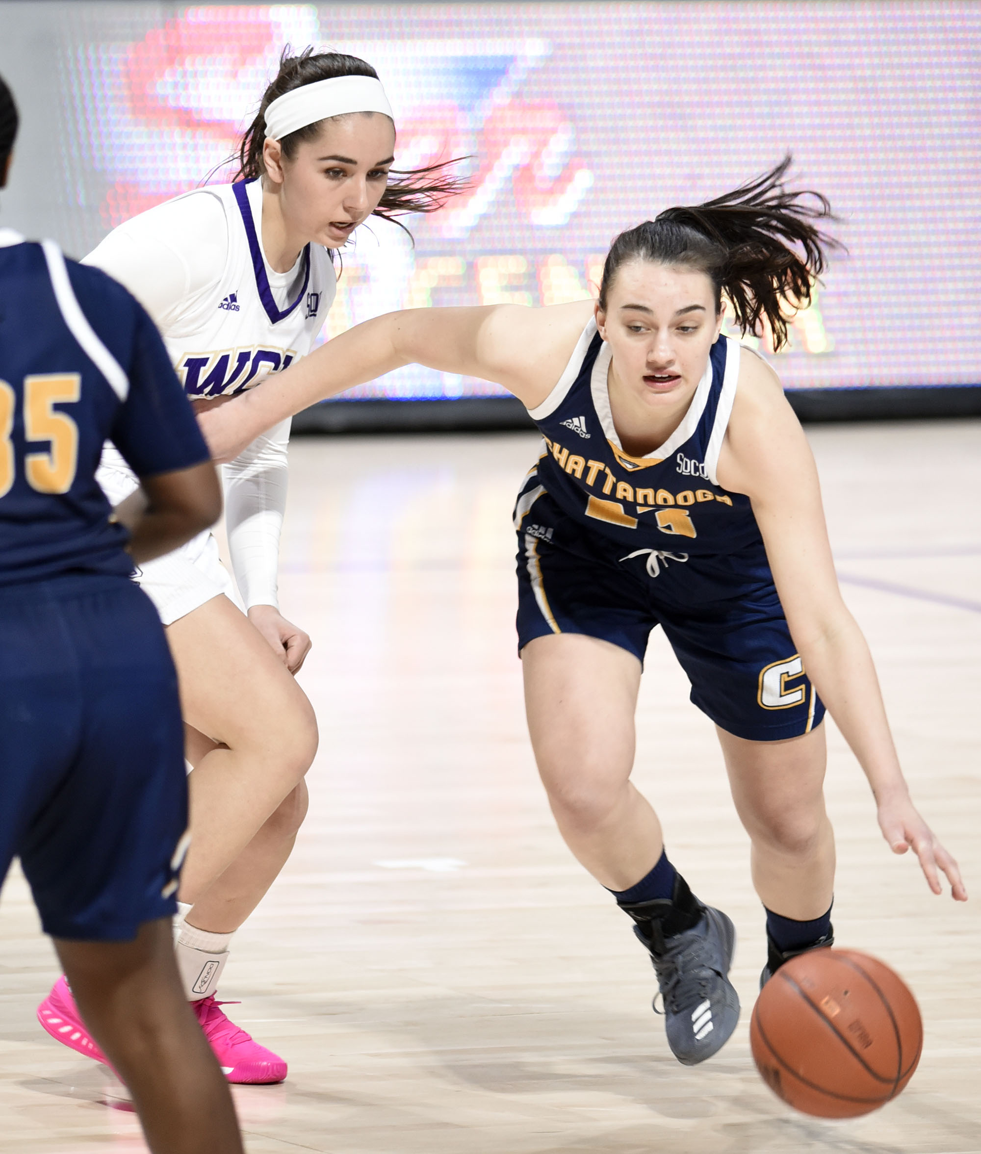 UTC's Brooke Burns (23) dribbles around the pick of Aryanna Gilbert (35). The University of Tennessee Mocs visited the Western Carolina Catamounts in Southern Conference women's basketball action at the Ramsey Center in Cullowhee, North Carolina on February 1, 2018