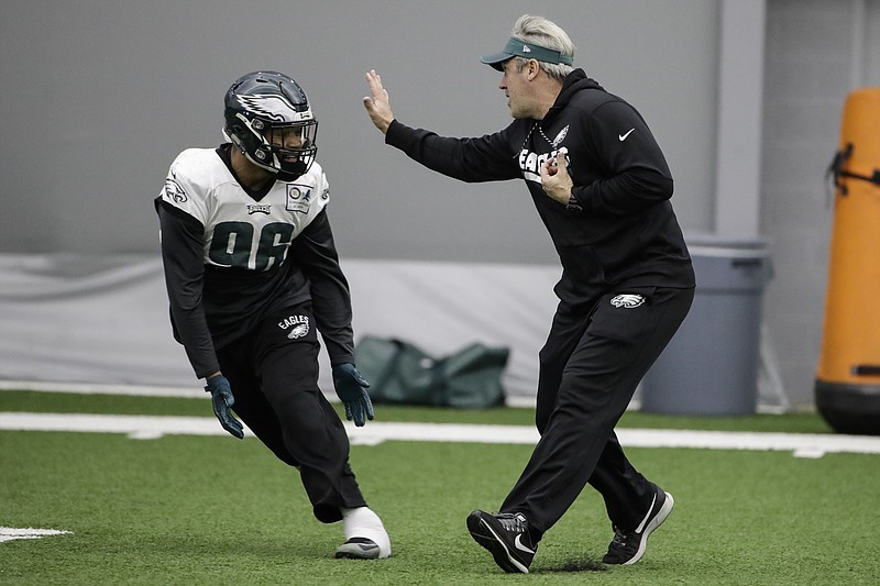 Philadelphia Eagles coach Doug Pederson, right, runs a drill with defensive end Derek Barnett during a practice last week in Philadelphia. Barnett, a former Tennessee Vol, will play in the Super Bowl as a rookie.