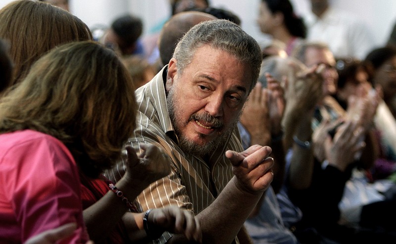 In this March 14, 2012, file photo, Fidel Castro Diaz-Balart, son of then Cuban leader Fidel Castro, speaks with an unidentified woman during the presentation of his father's book "Nuestro Deber es Luchar," or "Our Duty is to Fight," in Havana, Cuba. According to Cuban state media on Feb. 1