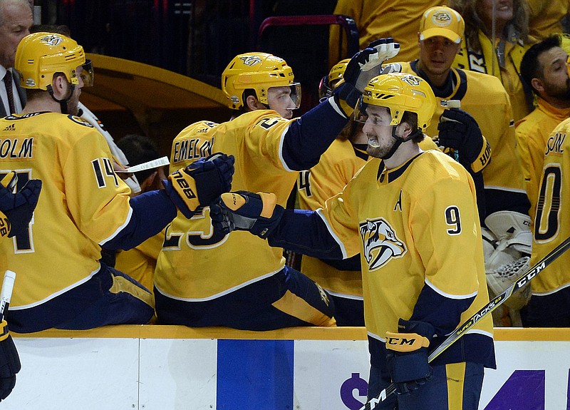 Nashville Predators left wing Filip Forsberg (9), of Sweden, is congratulated after scoring a goal against the Los Angeles Kings during the first period of an NHL hockey game Thursday, Feb. 1, 2018, in Nashville, Tenn. (AP Photo/Mark Zaleski)