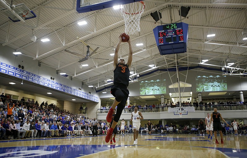 Oak Hill Academy's Keldon Johnson (3) goes up for a dunk against McCallie during the third annual Dr Pepper TEN basketball showcase at the Walker Forum on the campus of the McCallie School on Friday, Feb. 2, 2018 in Chattanooga, Tenn.