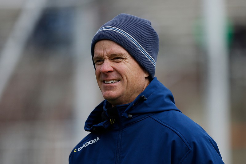 Chattanooga FC coach Bill Elliott watches his team warm up before an exhibition match against MLS team FC Dallas at Finley Stadium in February. 