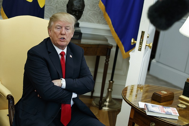 
              In this Feb. 2, 2018, photo, President Donald Trump speaks during a meeting with North Korean defectors where he talked with reporters about allowing the release of a secret memo on the FBI's role in the Russia inquiry, in the Oval Office of the White House in Washington. Ignoring the objections of the Justice Department and warnings from his own staff, Trump’s authorization of the release of a bitterly disputed, formerly highly classified memo was his latest contentious move to upend the investigation into his campaign’s ties to Russia or whether the president obstructed justice.(AP Photo/Evan Vucci)
            