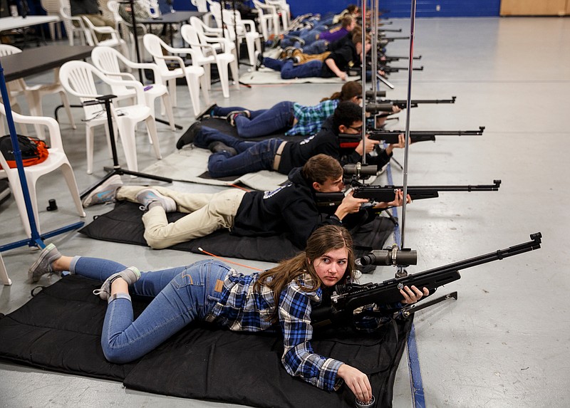 Savannah Crowe competes with the Ooltewah rifle team in the Superintendent's Match for JROTC rifle teams at Red Bank High School on Saturday, Feb. 3, 2018, in Chattanooga, Tenn. Shooters on the teams compete with air rifles firing from prone, standing and kneeling positions.