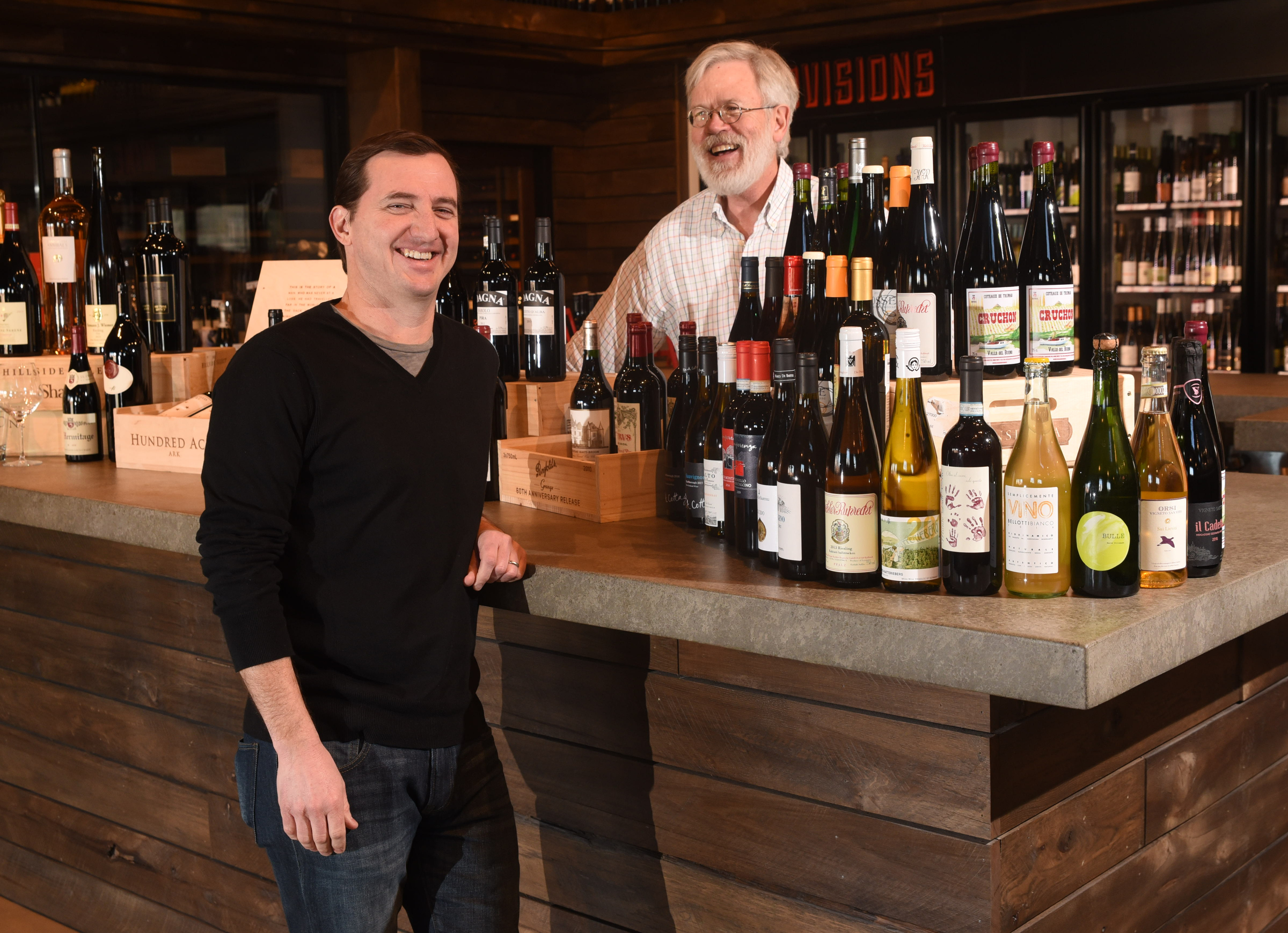 Business partner's Josh Carter, left, and Brian Leutwiler stand among rare grower wines they stock at Imbibe at 1616 Broad St.