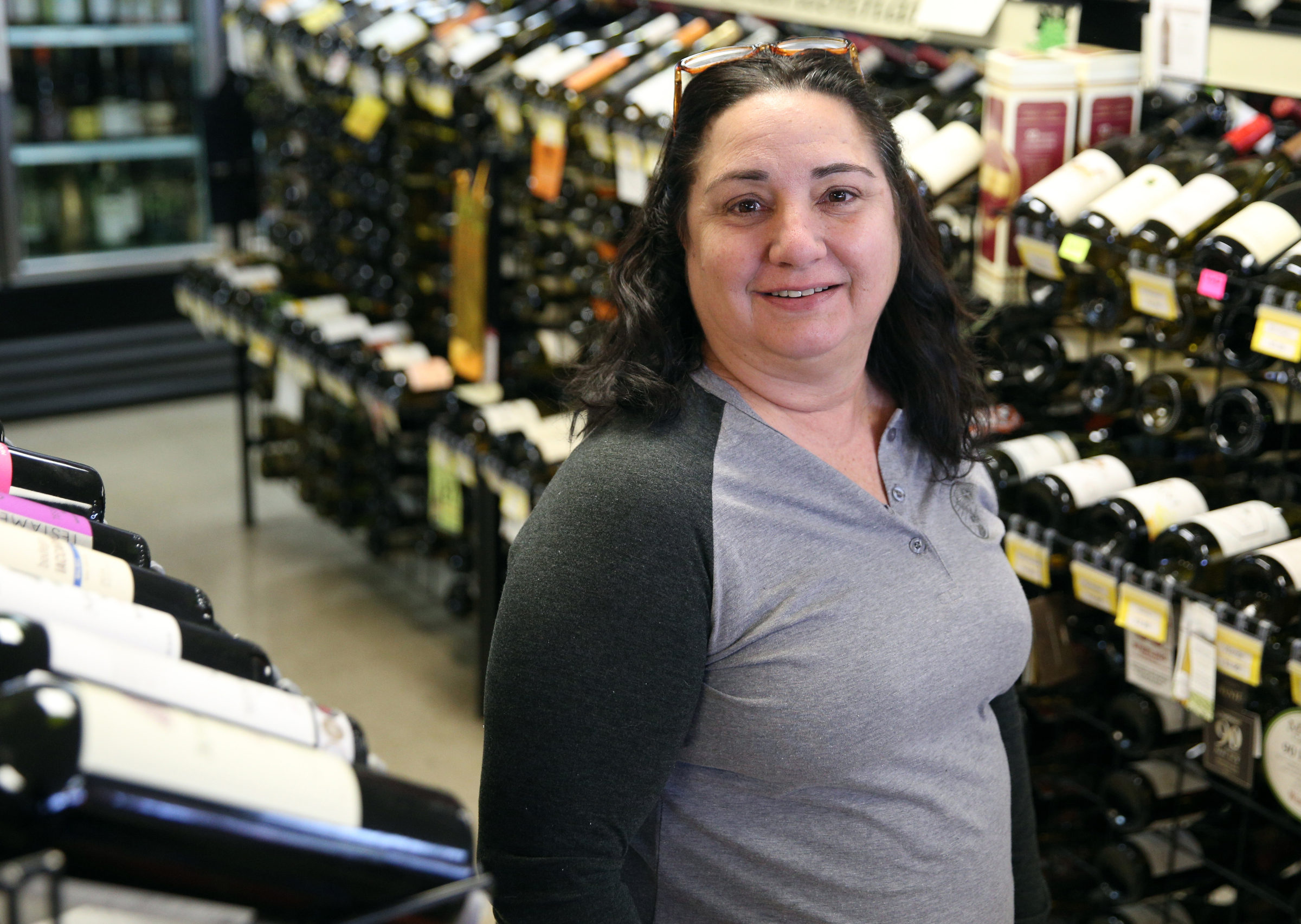 Lori Sharp, owner of Bacchus Wine and Spirits, poses for a photo at Bacchus Wine and Spirits Thursday, Jan. 25, 2018 in Hixson, Tenn. Sharp said her business hasn't been hurt too much by the availability of wine in grocery stores.