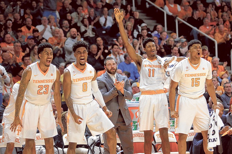 Tennessee guard Jordan Bowden (23), Jordan Bone (0), Kyle Alexander (11) and Derrick Walker (15) celebrate a basket by a teammate in the second half of an NCAA college basketball game against Mississippi on Saturday, Feb. 3, 2018, in Knoxville, Tenn. (AP Photo/Crystal LoGiudice)