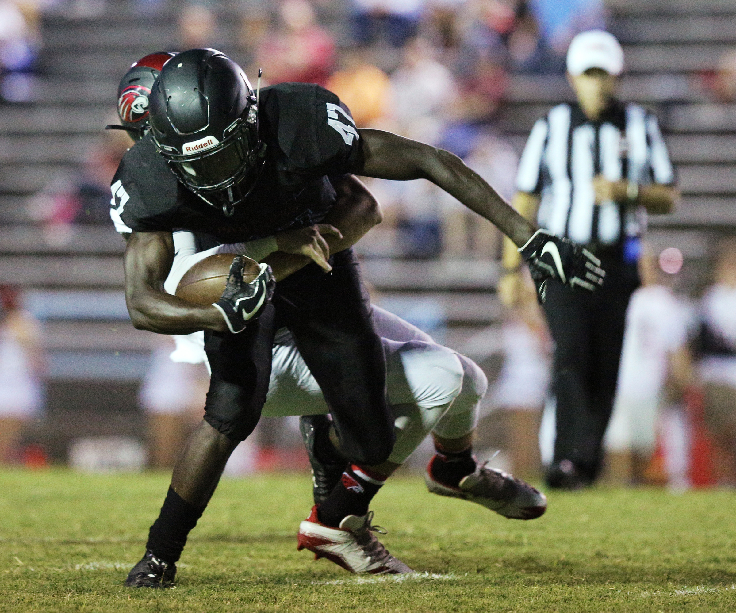 Brainerd wide receiver Joseph Norwood (47) is tackled by Signal Mountain's Campbell Garner (24) during the Signal Mountain High School vs. Brainerd High School football game at Brainerd High School Friday, Sept 29, 2017.