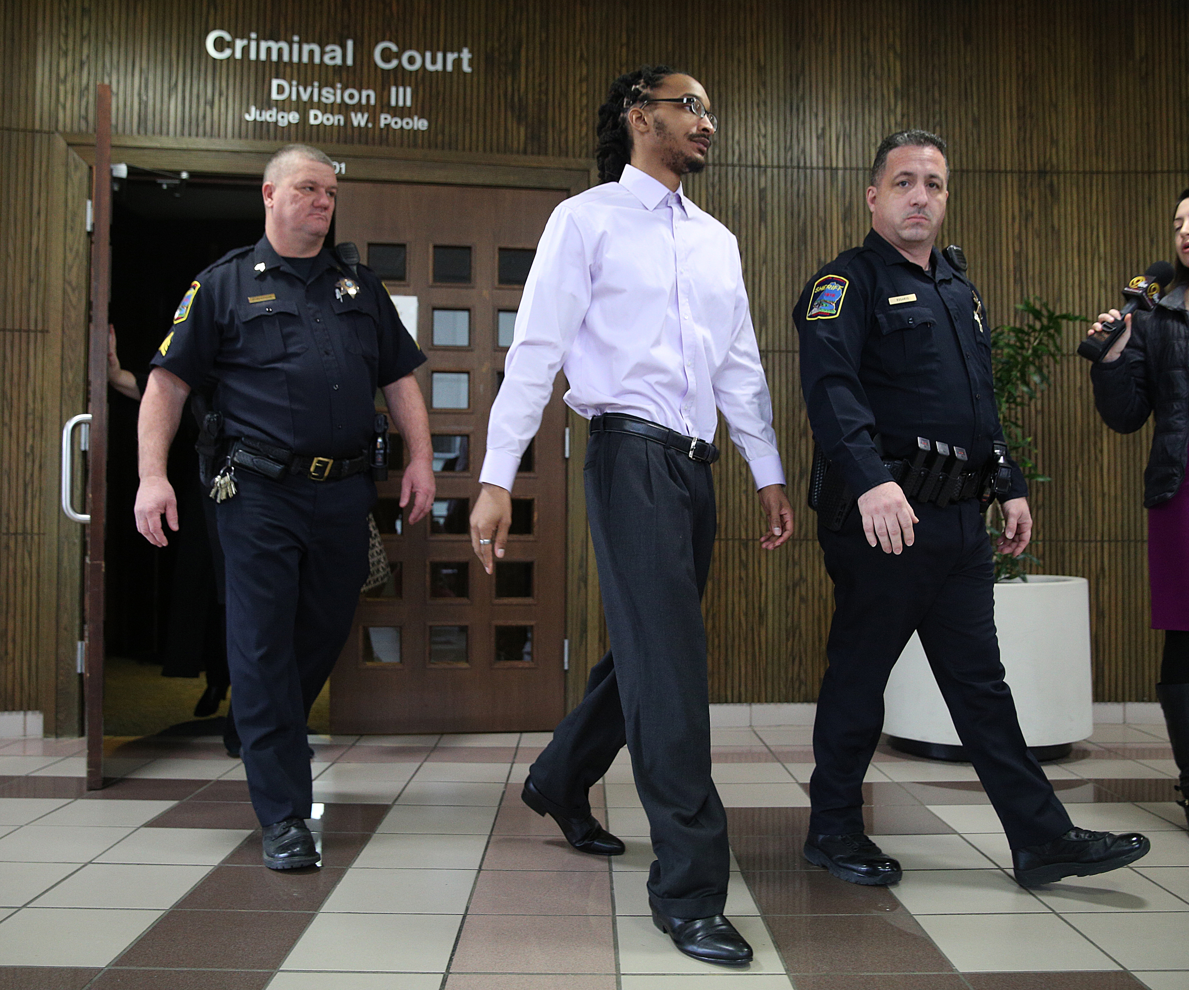 Johnthony Walker leaves the Hamilton County Criminal Courthouse with Hamilton County Sheriff's deputies following a pretrial hearing in Walker's case Monday, Feb. 5, 2018 in Judge Don Poole's courtroom at the Hamilton County Criminal Courthouse in Chattanooga, Tenn. Walker was the bus driver in the Nov. 21, 2016 fatal bus crash that killed six Woodmore Elementary Students.