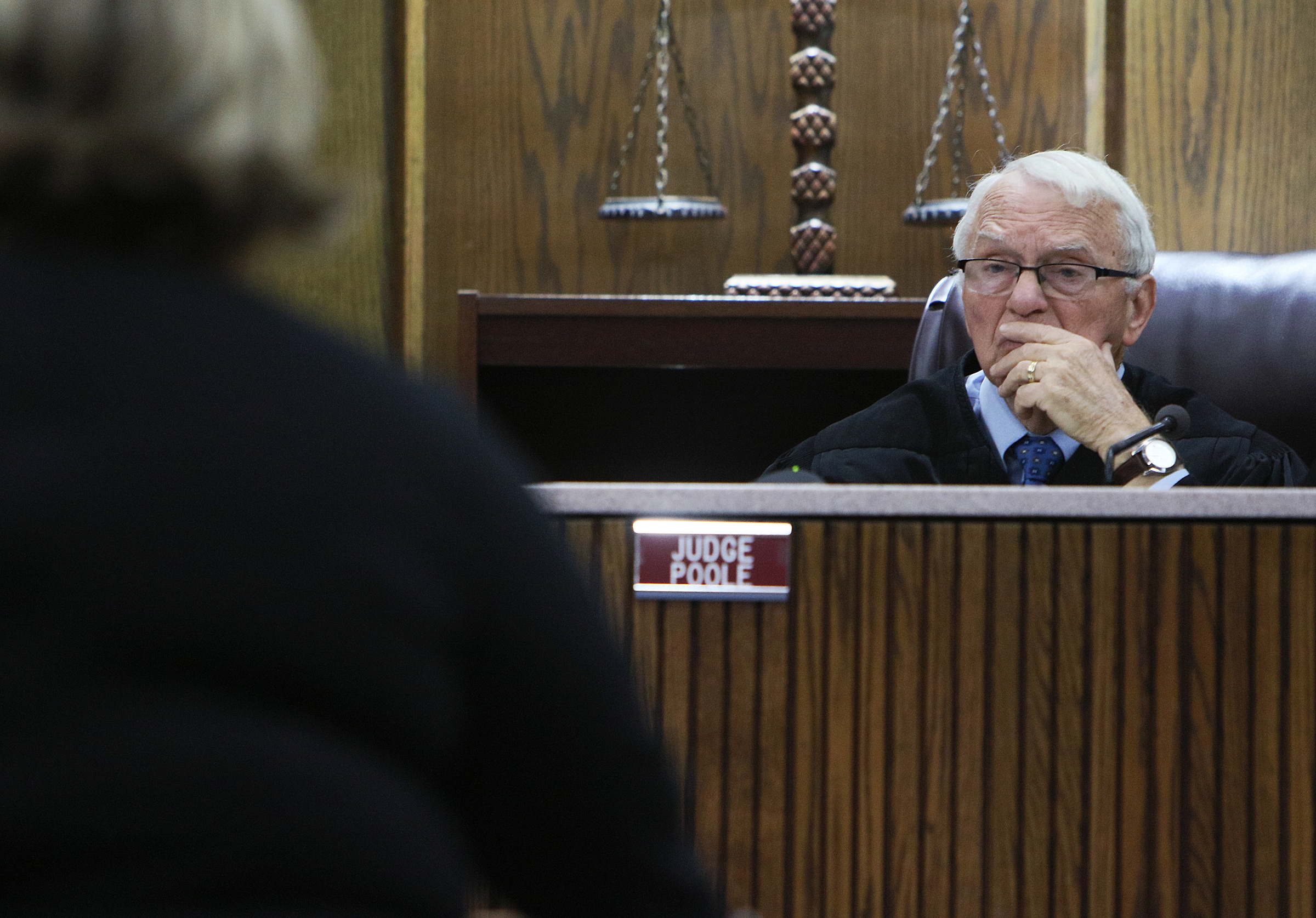Judge Don Poole listens as Johnthony Walker's defense attorney Amanda Dunn speaks during a pretrial hearing in Walker's case Monday, Feb. 5, 2018 at the Hamilton County Criminal Courthouse in Chattanooga, Tenn. Walker was the bus driver in the Nov. 21, 2016 fatal bus crash that killed six Woodmore Elementary Students.