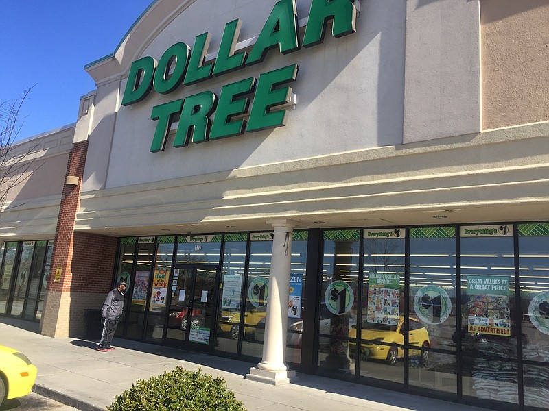 A shopper looks at the notice of closing at the Dollar Tree in Brainerd, which was shut down last week by state health regulators after an investigator found dead rodents in the grocery store.