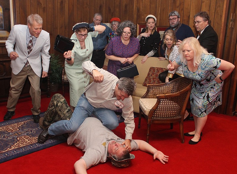 Tim Forsythe, on floor, and Dennis Parker get in a brawl as friends and family react in a scene from "Dearly Departed." On the second row, from left, are, Jeff Buchwald, Patti Gross, Michelle Ford, Shandra Burnett and Janet McInturff. In back are Ken Gross, Amanda West, Jennifer Baggett, John Nichols and Mark Oglesby.