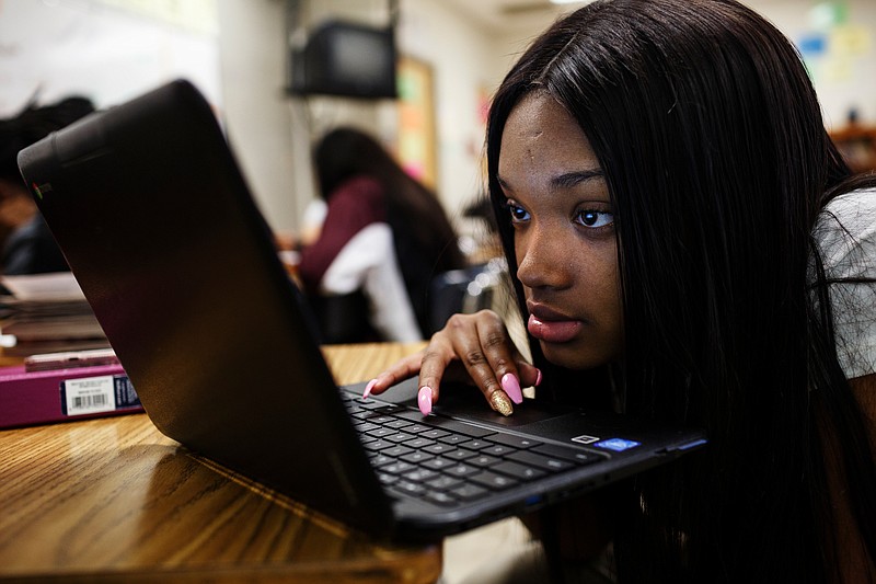 Staff photo by Doug Strickland / Jamirria Eldridge works on an assignment on a Chromebook during an ACT preparation class for juniors at The Howard School on Wednesday. Teacher Ashley Cox is raising funds for extra Chromebooks through DonorsChoose.