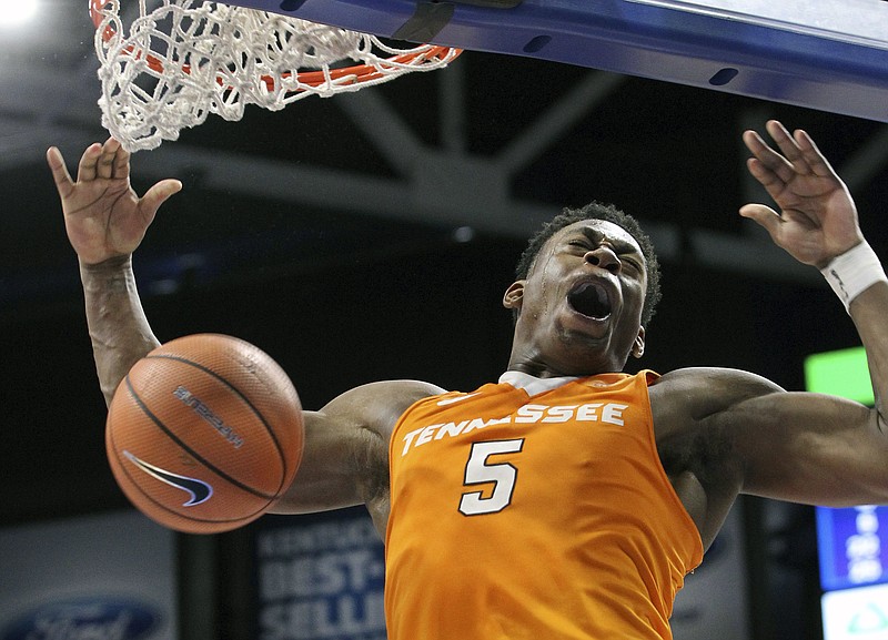 Tennessee's Admiral Schofield dunks for Tennessee's final basket in their 61-59 win over Kentucky during an NCAA college basketball game, Tuesday, Feb. 6, 2018, in Lexington, Ky. (AP Photo/James Crisp)