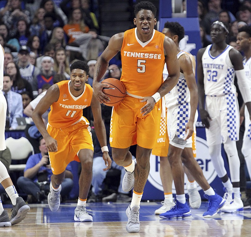 Tennessee's Admiral Schofield (5) and Kyle Alexander (11) celebrate after an NCAA college basketball game against Kentucky, Tuesday, Feb. 6, 2018, in Lexington, Ky. Tennessee won 61-59. (AP Photo/James Crisp)