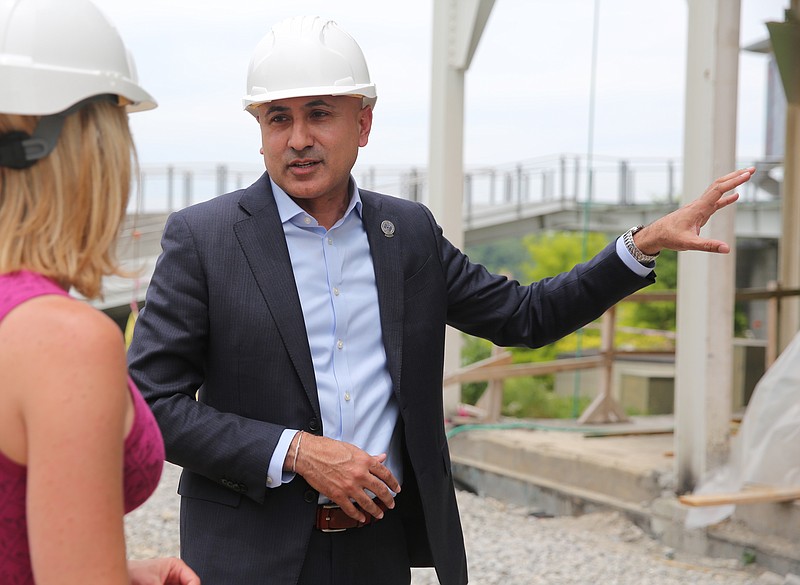 Vision Hospitality Group chief Mitch Patel points out features The Edwin Hotel will include Wednesday, May 17, 2017, at street level of the site for the hotel in Chattanooga, Tenn. The cost of the 90-room boutique hotel was estimated to come in at about $27 million, or $300,000 per unit.