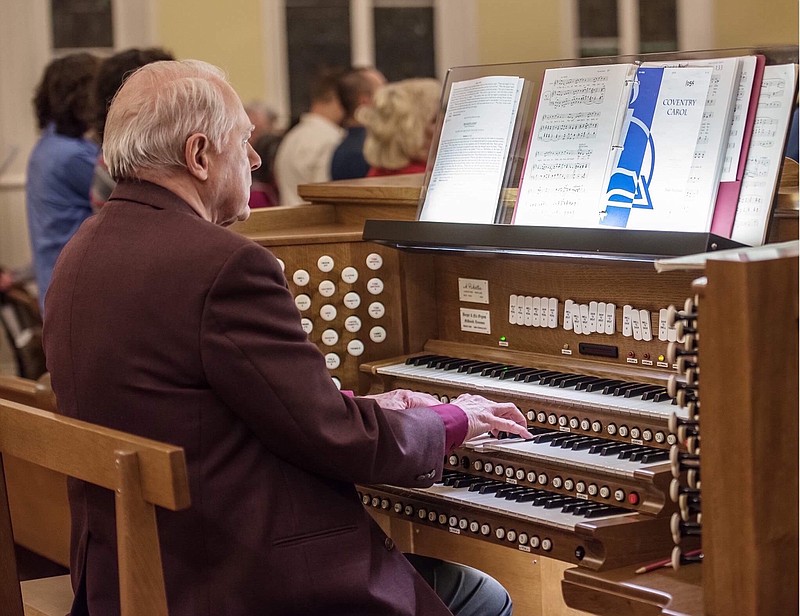 David Friberg plays the organ at Second Presbyterian Church, which was relocated from choir loft's pit at the front of the church sanctuary to the back of the congregation.