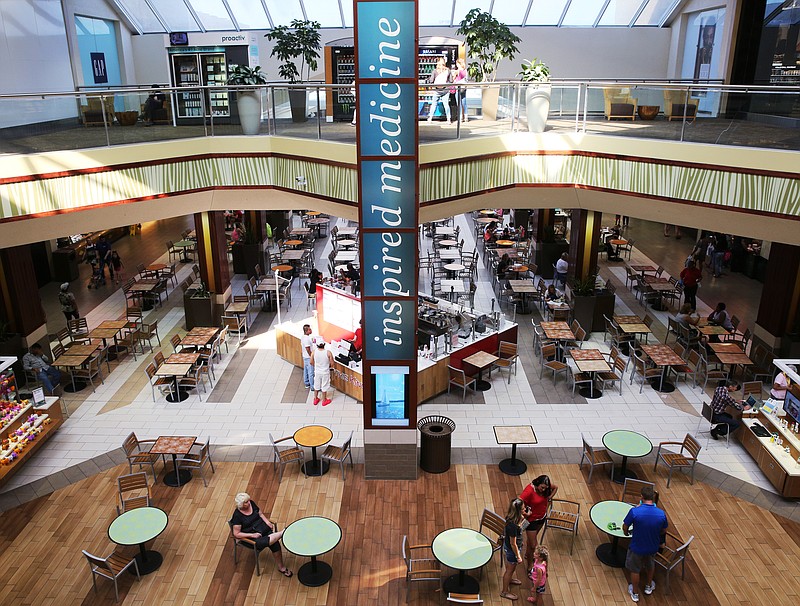 People come and go from the food court of Hamilton Place mall in Chattanooga last year.