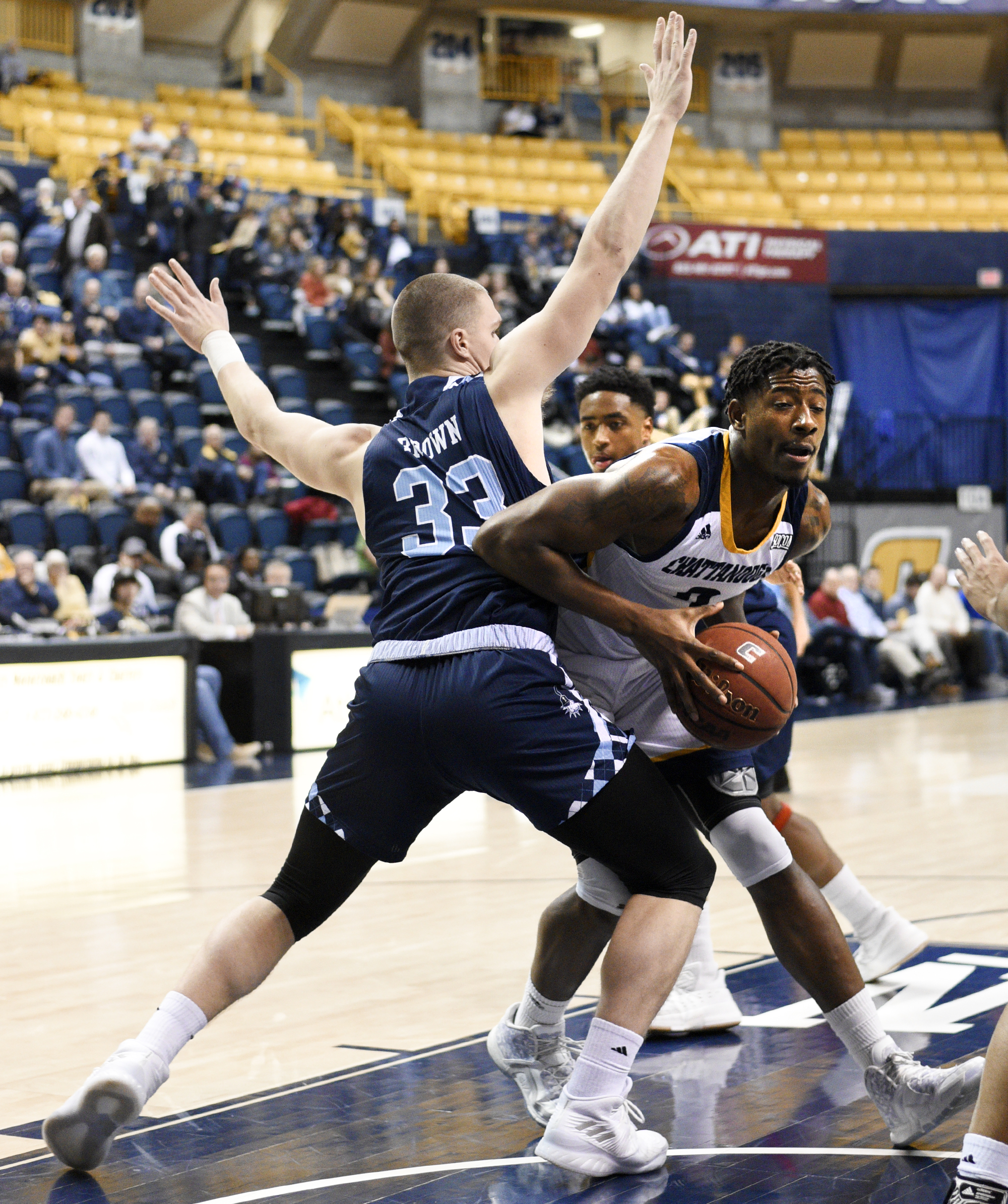 UTC's Joshua Phillips (2) tries to get around The Citadel's Hayden Brown (33). The Citadel Bulldogs visited the University of Tennessee Chattanooga Mocs in Southern Conference basketball action at McKenzie Arena in Chattanooga, Tennessee on February 8, 2018.