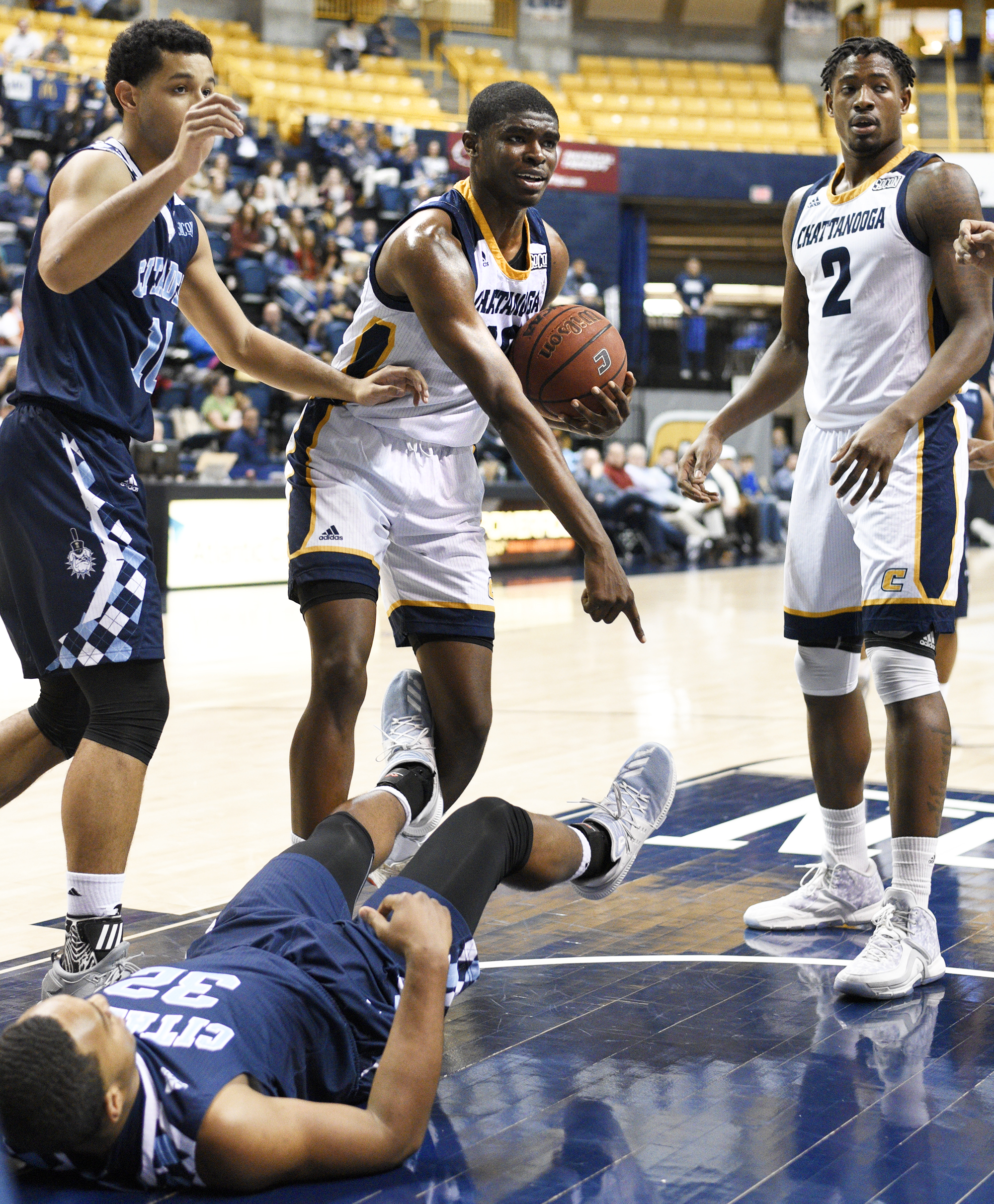 UTC's James Lewis Jr. (10) pleads his case to the official that he did not committ a foul agaisnt The Citadel's Derek Webster (32). The official disagreed and Lewis was called for charging. The Citadel Bulldogs visited the University of Tennessee Chattanooga Mocs in Southern Conference basketball action at McKenzie Arena in Chattanooga, Tennessee on February 8, 2018.