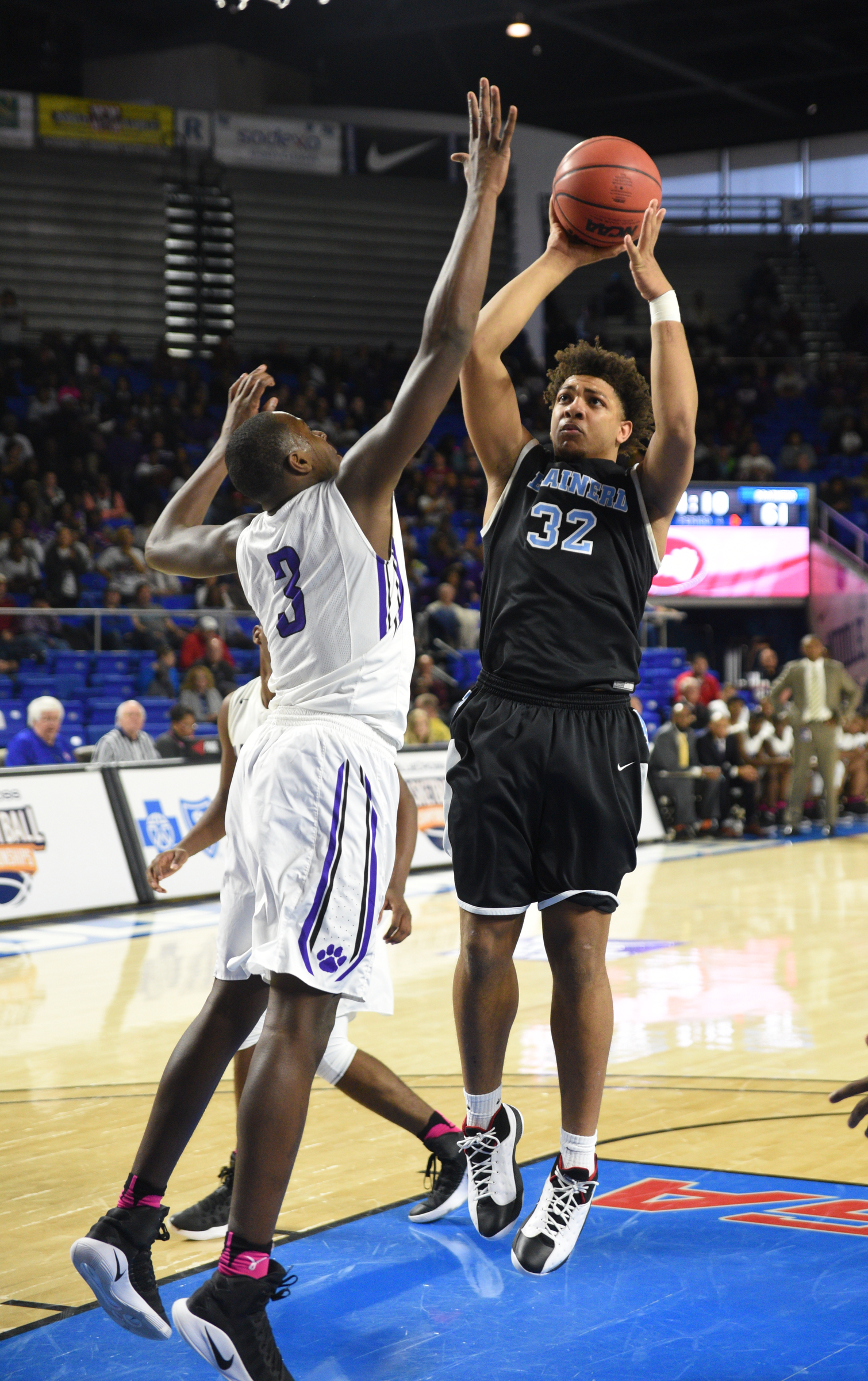 Brainerd's Jessie Walker shoots over Haywood's Markeston Douglas Thursday, March 16, 2017 in Murphy Center at Middle Tennessee State University in Murfreesboro.