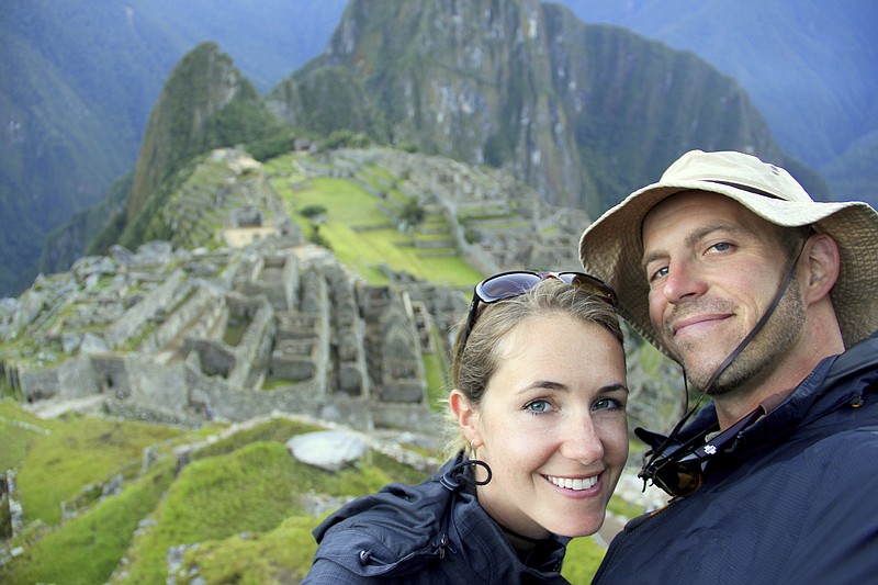 This undated image provided by Mike and Anne Howard shows the couple on a trek to Machu Picchu in Peru. The Howards' book, "Ultimate Journeys for Two: Extraordinary Destinations on Every Continent" grew out of their five-year adventure across seven continents as "the world's longest honeymooners," an experience they chronicled on their blog HoneyTrek.com. (Mike and Anne Howard via AP)