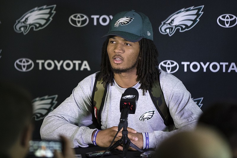 
              FILE - In this May 12, 2017 file photo, Philadelphia Eagles' Sidney Jones speaks with members of the media during NFL football rookie minicamp at the team's training facility in Philadelphia. A group of fans have helped return  Jones' lost cellphone during the team's Super Bowl victory parade, but not before taking a selfie. Jones was with several of his teammates in Philadelphia on Thursday, Feb. 8, 2018,  as they celebrated the Eagles' 41-33 victory over the favored New England Patriots when his phone reportedly fell out of his back pocket. A photo appeared on the player's verified Instagram page shortly afterward that showed several smiling fans with the caption, "Guess who dropped their phone at the parade!" The fans promised to return it.(AP Photo/Matt Rourke, File)
            