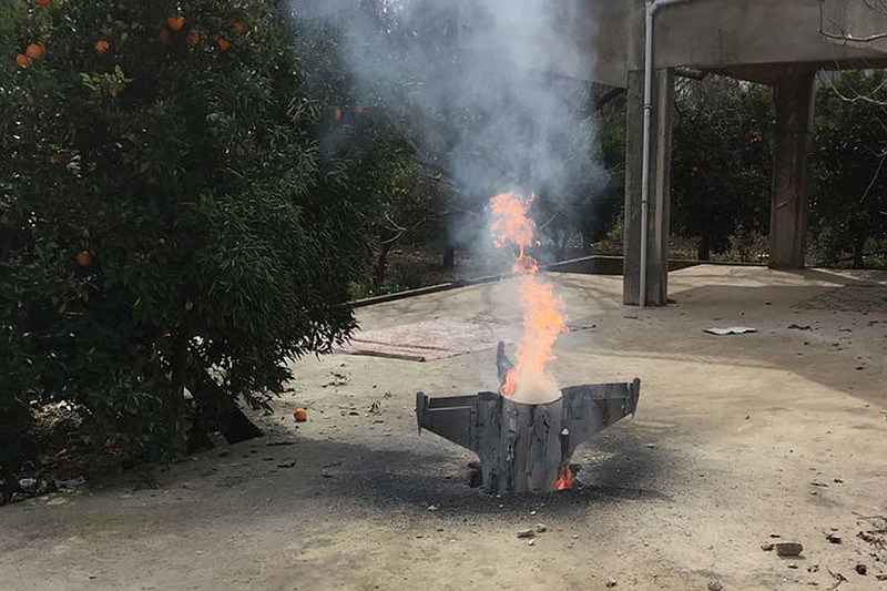 
              Flames rise from a missile, which according to the Lebanon national news agency appears to be part of a Syrian air defense missile targeting an Israeli warplane which landed in a lemon grove, in Hasbani village, southwest Lebanon, Saturday, Feb. 10, 2018. Lebanon is protesting Israel's use of its airspace to target Syria, saying it will complain to the U.N. Security Council. (AP Photo)
            