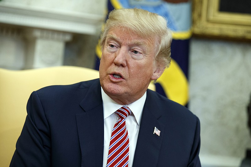 President Donald Trump speaks during a meeting with Shane Bouvet, a campaign volunteer, in the Oval Office of the White House, Friday, Feb. 9, 2018, in Washington. (AP Photo/Evan Vucci)