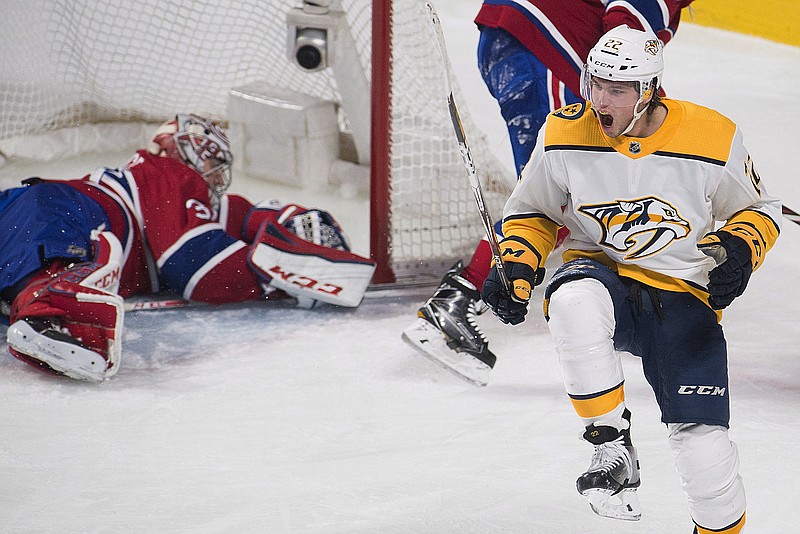 Nashville Predators' Kevin Fiala (22) celebrates after scoring against Montreal Canadiens goaltender Carey Price during the third period of an NHL hockey game Saturday, Feb. 10, 2018, in Montreal. (Graham Hughes/The Canadian Press via AP)