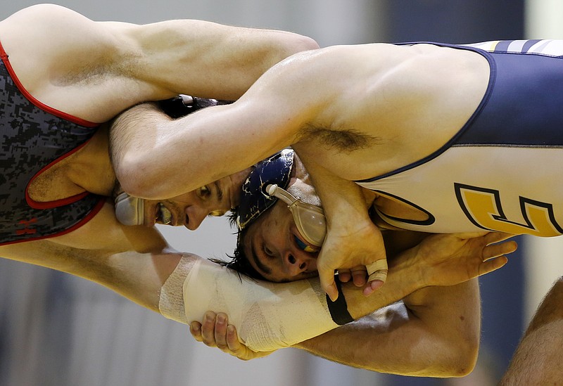 UTC's Chad Pyke, right, wrestles Gardner-Webb's Brett Stein during the 165-pound bout in Sunday's dual at Maclellan Gymnasium. Pyke won 6-4, and the Mocs won 37-5 on senior day.