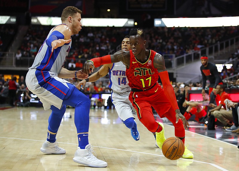 Atlanta Hawks guard Dennis Schroder (17) drives to the basket as Detroit Pistons forward Blake Griffin (23) defends in the first half of an NBA basketball game on Sunday, Feb. 11, 2018, in Atlanta. (AP Photo/Todd Kirkland)