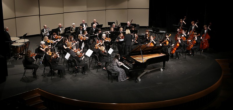 Xinwen Zhang, center, plays Felix Mendelssohn's "Piano Concerto in G Minor, Opus 25" during the UTC Symphony Orchestra's Concerto Concert in the Roland Hayes Concert Hall in the Fine Arts Center on the campus of the University of Tennessee at Chattanooga on Sunday, Feb. 11, 2018, in Chattanooga, Tenn.