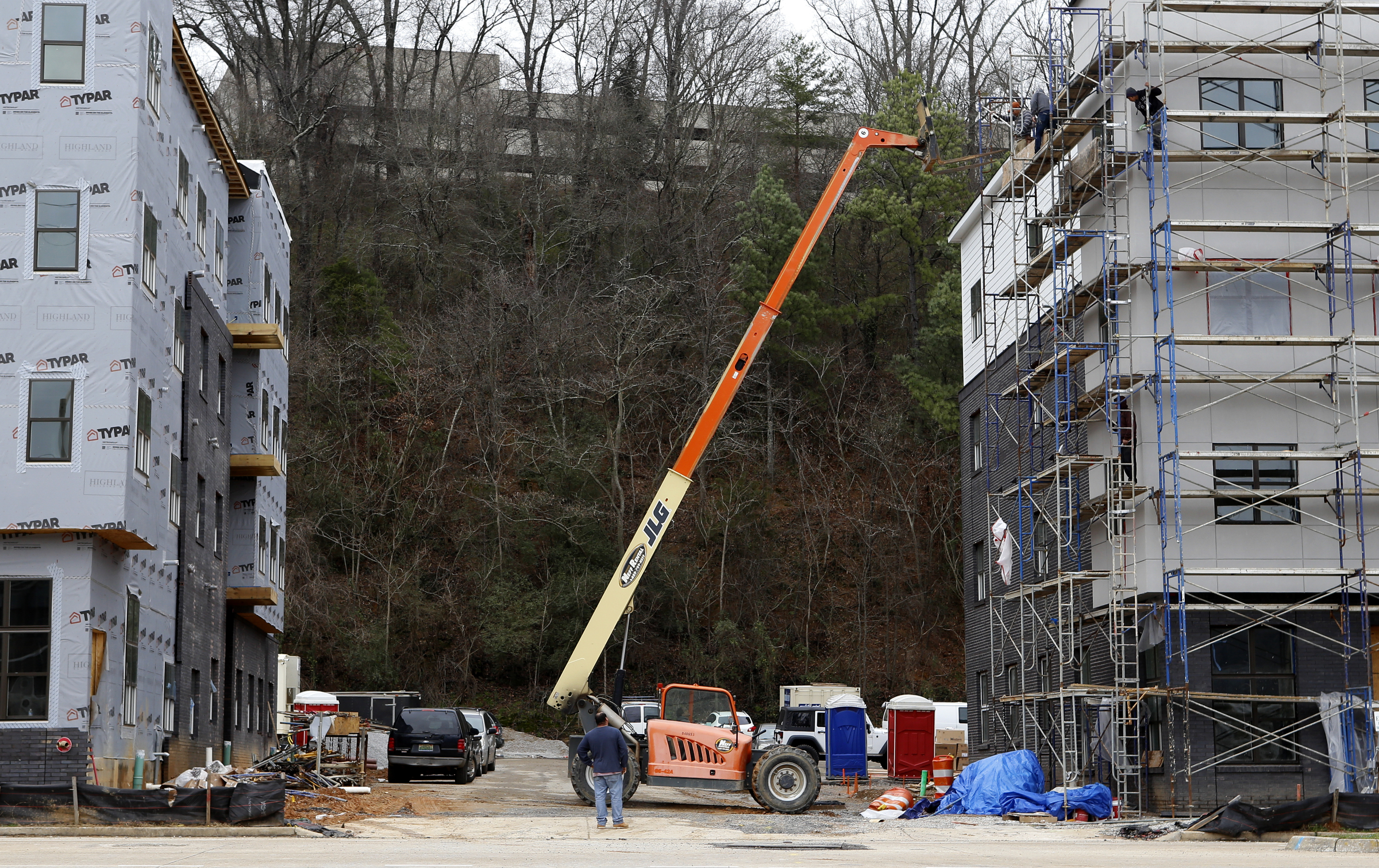 Construction continues on a retail building, right, along Riverfront Parkway in the Cameron Harbor area on Monday, Feb. 12, 2018 in Chattanooga, Tenn. The retail building is part of a tax-increment financing plan that would give a builder a property tax break in return for extending Martin Luther King Boulevard to the Tennessee River and the riverwalk. On the left is an under-construction apartment building.