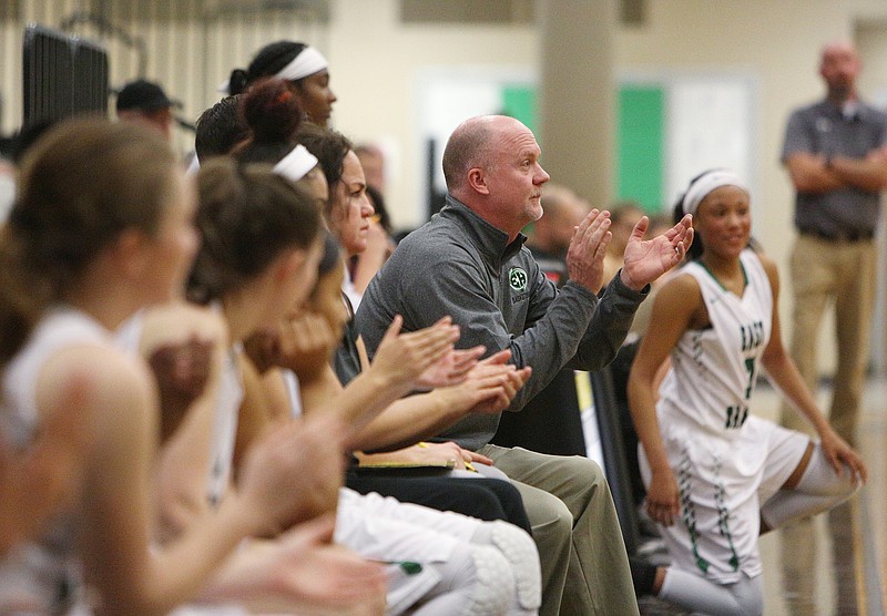 East Hamilton head basketball coach Hunter Gremore claps as his team scores during the East Hamilton vs. McMinn County girls basketball game Monday, Feb. 12, 2018 at East Hamilton Middle High School in Ooltewah, Tenn.