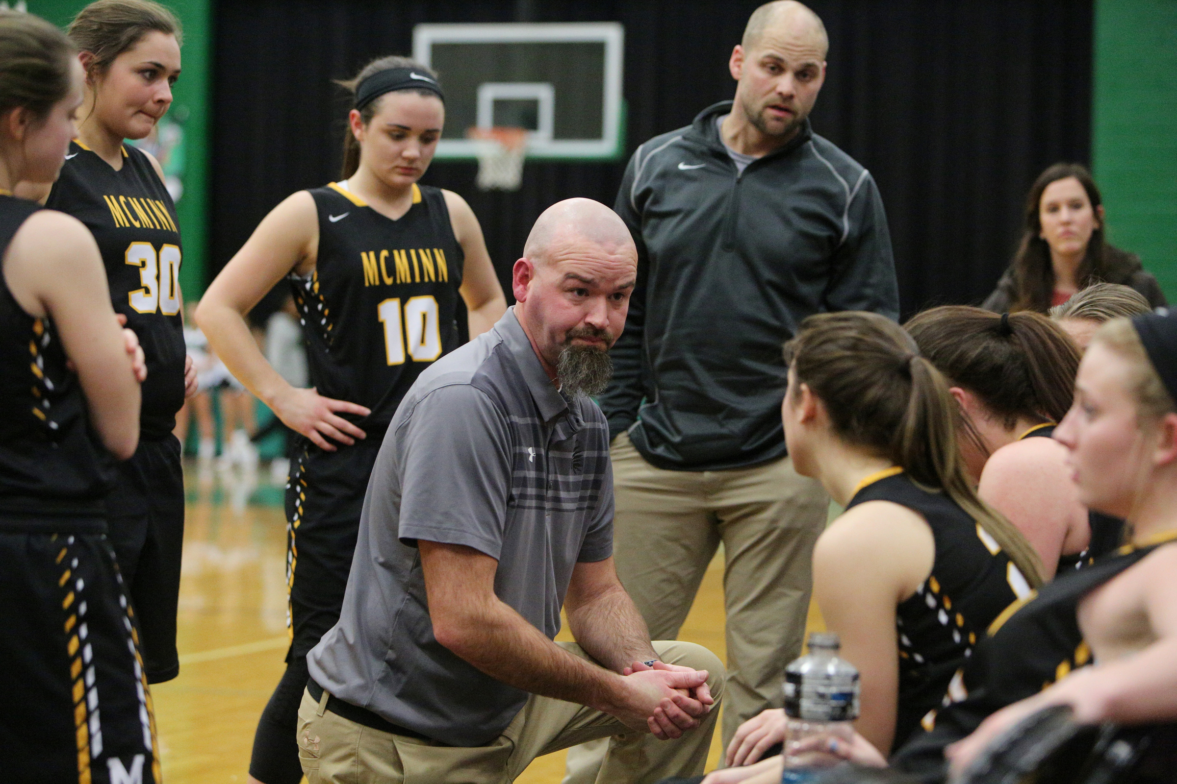 McMinn County head basketball coach Tim McPhail speaks with his team during a timeout in the East Hamilton vs. McMinn County girls basketball game Monday, Feb. 12, 2018 at East Hamilton Middle High School in Ooltewah, Tenn.