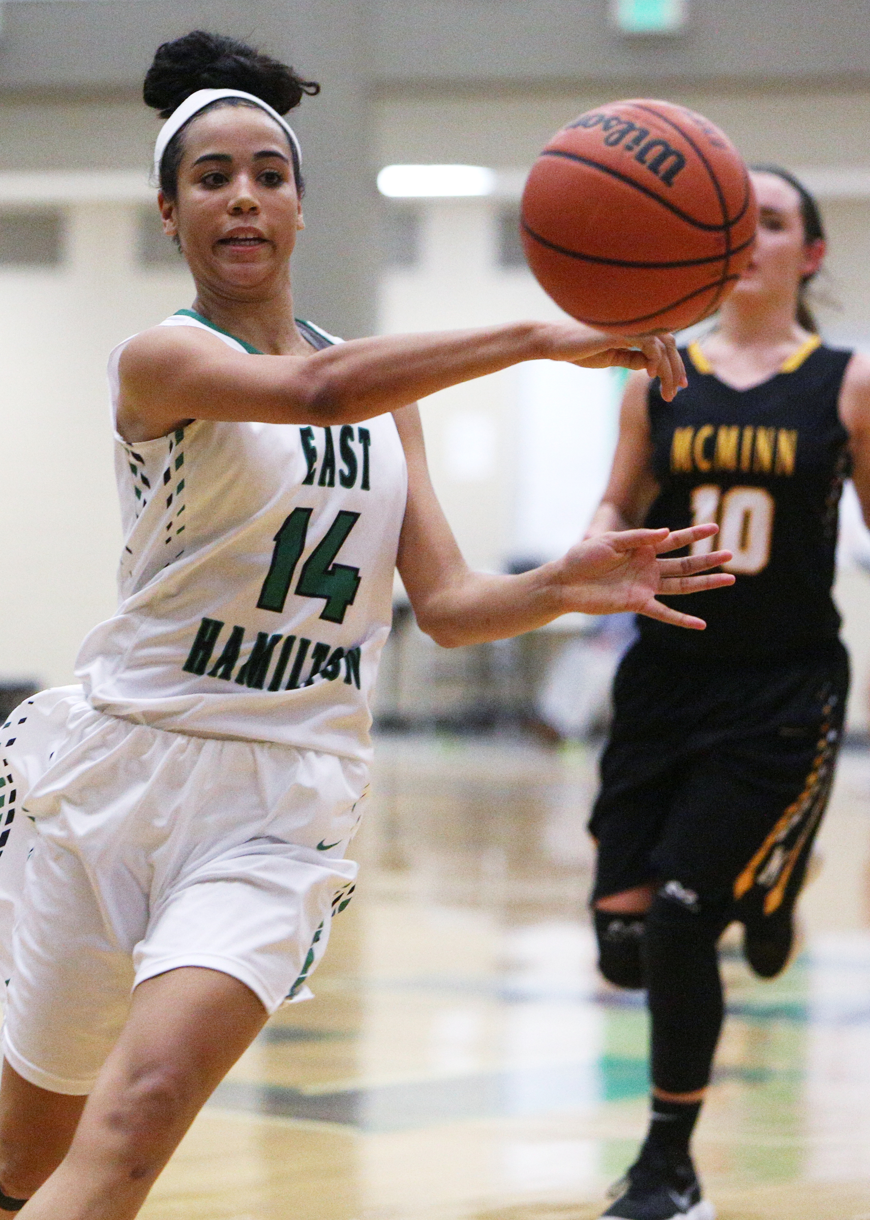 East Hamilton's Madison Hayes (14) passes the ball off to a teammate during the East Hamilton vs. McMinn County girls basketball game Monday, Feb. 12, 2018 at East Hamilton Middle High School in Ooltewah, Tenn.