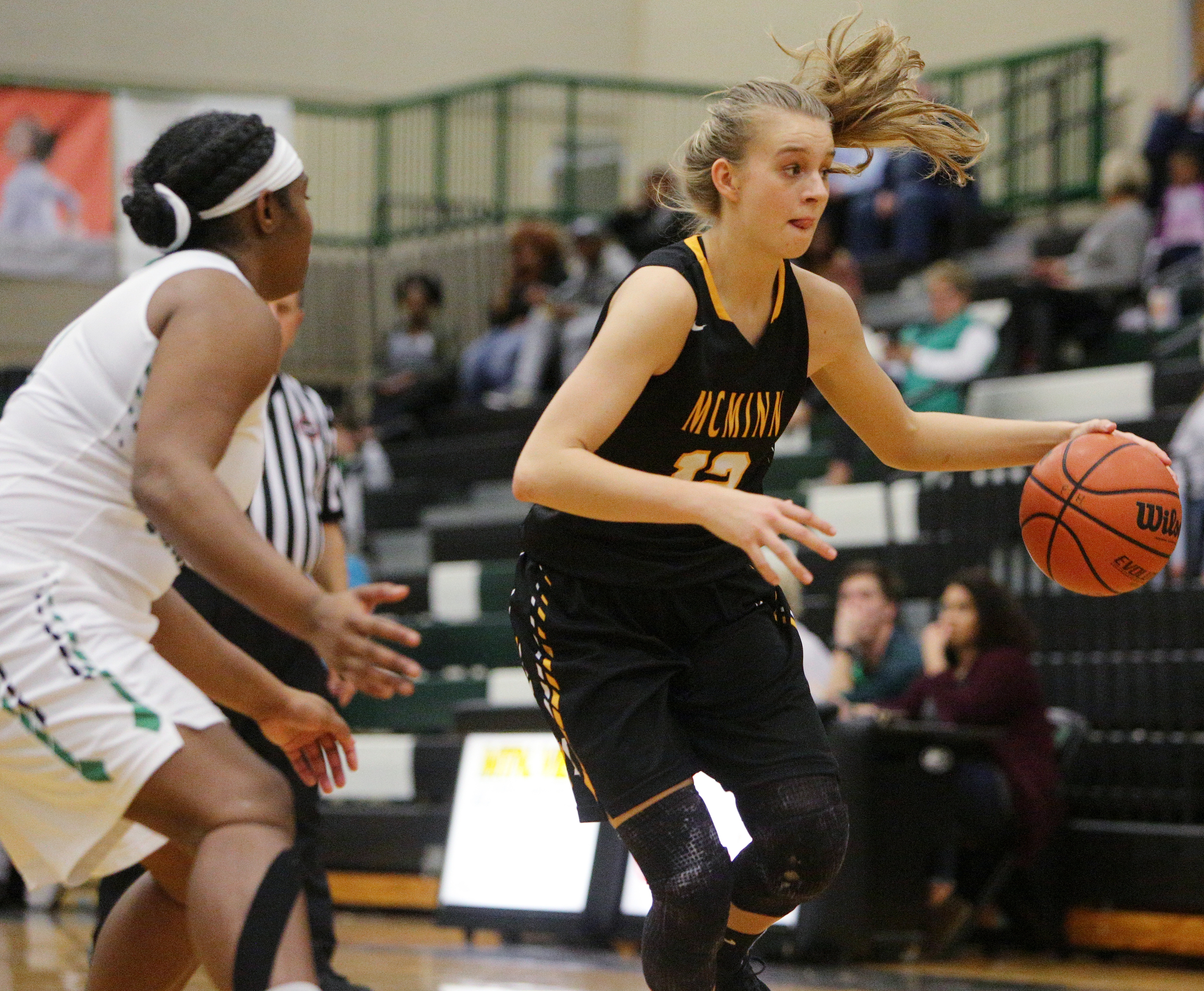 McMinn County's Kaitlynn Hennessee (12) dribbles the ball downcourt during the East Hamilton vs. McMinn County girls basketball game Monday, Feb. 12, 2018 at East Hamilton Middle High School in Ooltewah, Tenn.