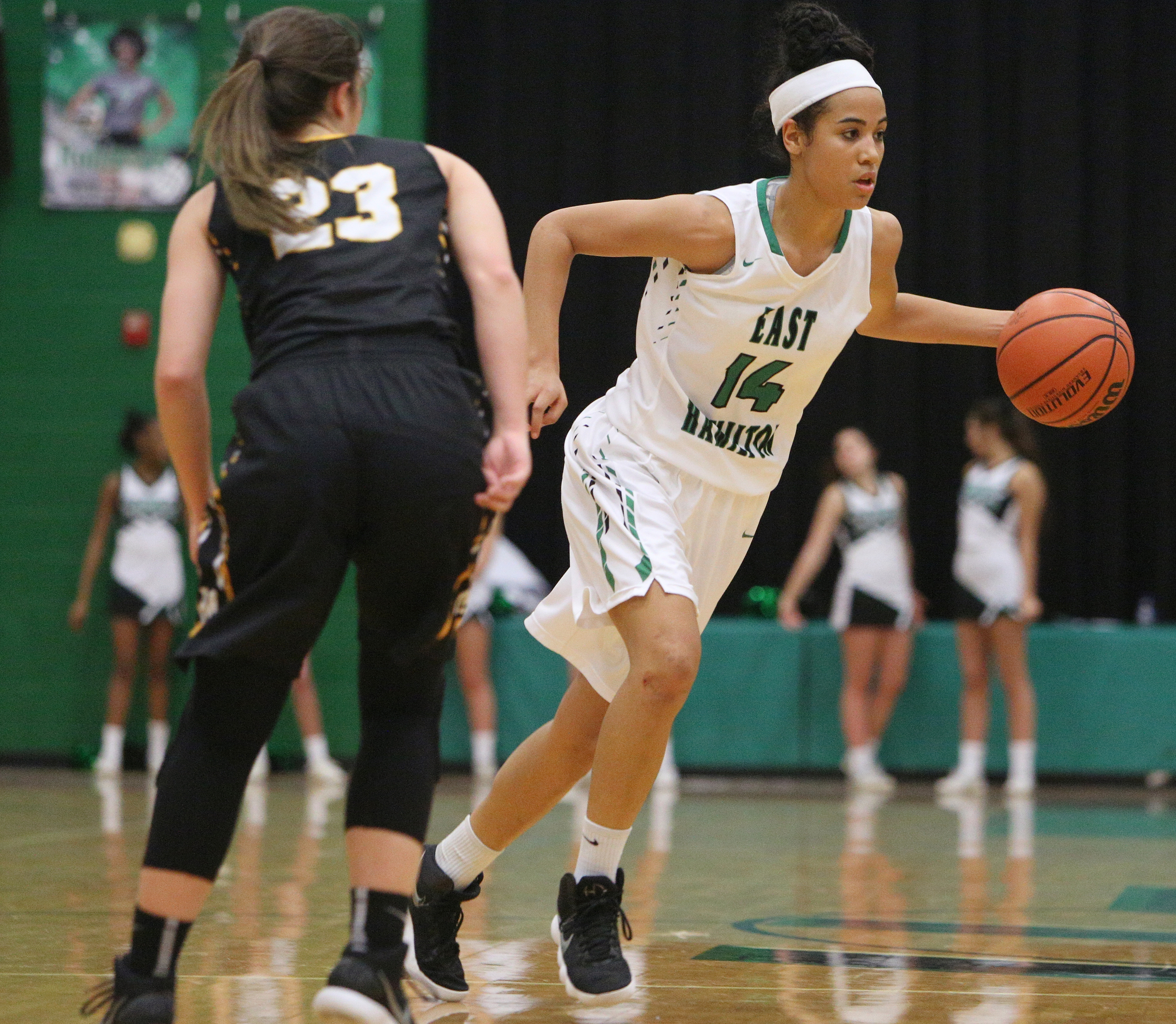 McMinn County's Kaylen Hicks (23) guards East Hamilton's Madison Hayes (14) as she dribbles the ball around the court during the East Hamilton vs. McMinn County girls basketball game Monday, Feb. 12, 2018 at East Hamilton Middle High School in Ooltewah, Tenn.