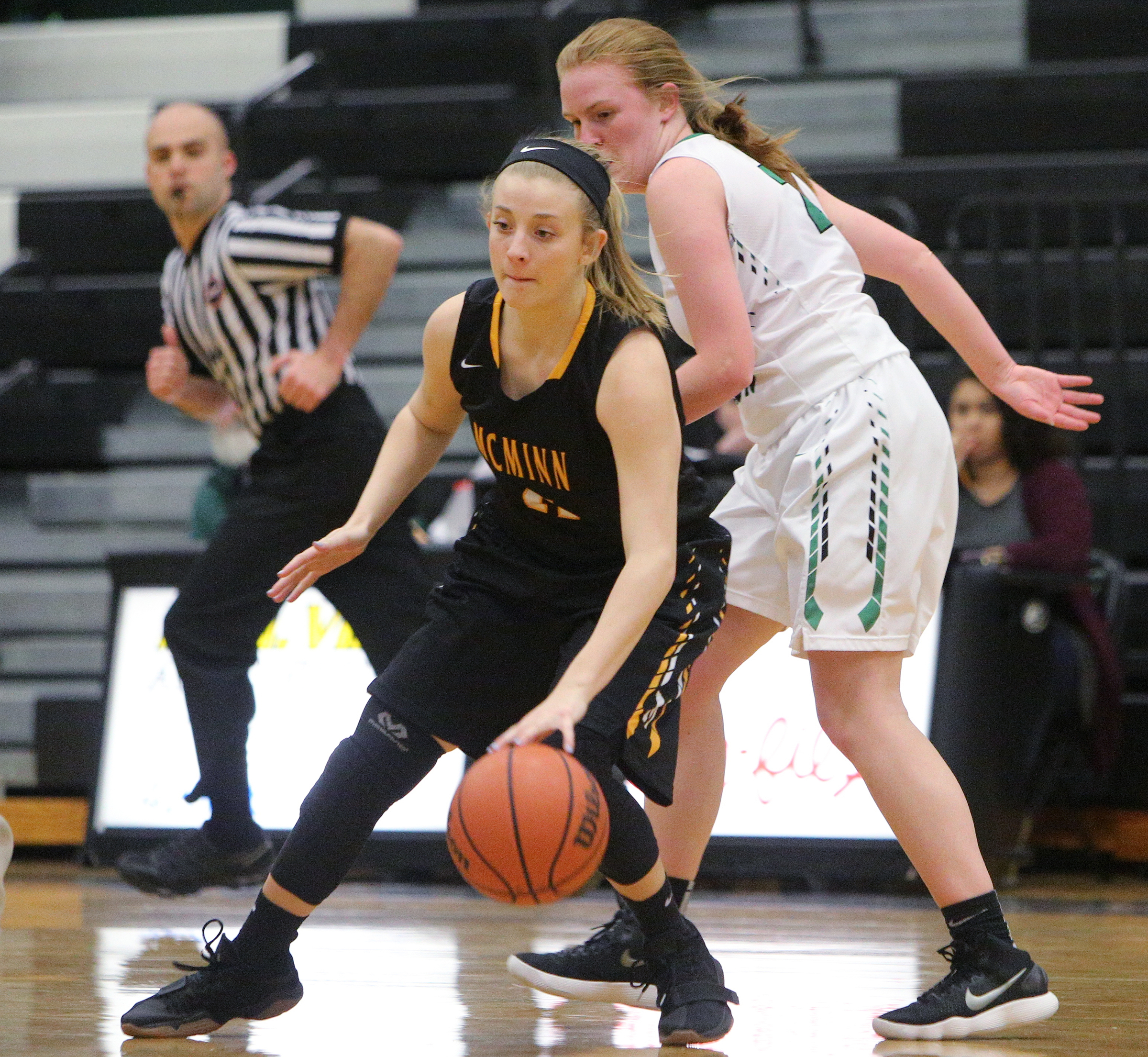 McMinn County's Hannah Burns (11) regains control of the ball before dribbling downcourt during the East Hamilton vs. McMinn County girls basketball game Monday, Feb. 12, 2018 at East Hamilton Middle High School in Ooltewah, Tenn.