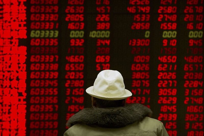 A Chinese investor monitors stock prices at a brokerage house in Beijing, Monday, Feb. 12, 2018. Asian stock markets are mostly higher after Wall Street gained following a week of history-making losses. (AP Photo/Mark Schiefelbein)