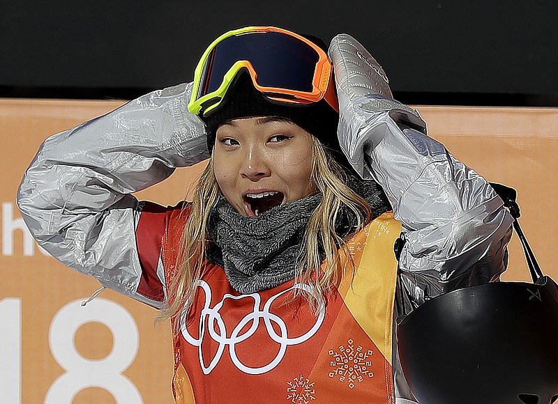 Chloe Kim, of the United States, reacts to her score during the women's halfpipe finals at Phoenix Snow Park at the 2018 Winter Olympics in Pyeongchang, South Korea, Tuesday, Feb. 13, 2018. (AP Photo/Gregory Bull)