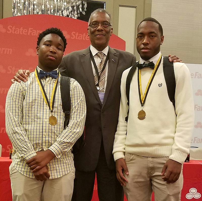 Erskine Oglesby, center, president of the 100 Black Men of Chattanooga, with Dereke Townsend, left, and Early McCullum, winners of last year's African-American History Challenge Bowl. The two teens competed at the 2017 National Championship in New Orleans. (Contributed Photo)