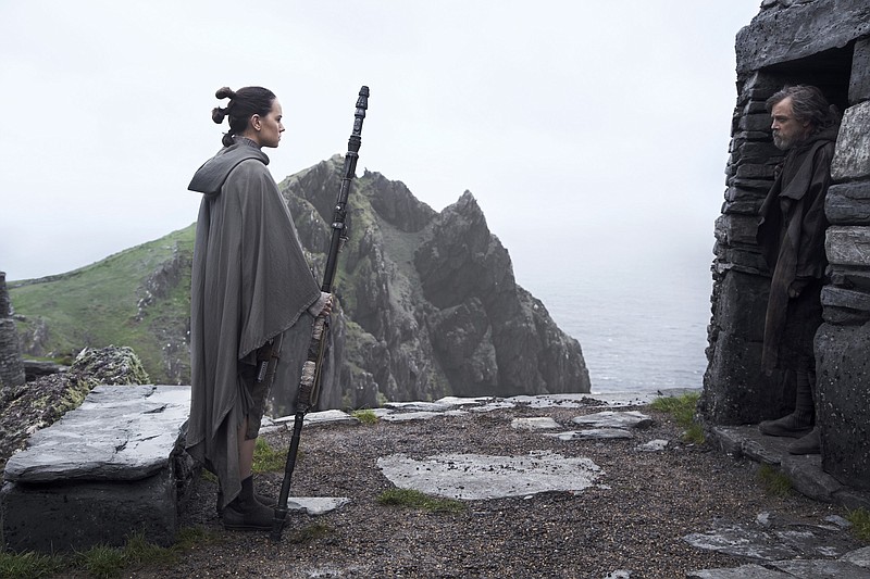 Rey (Daisy Ridley), left, confronts long-exiled Jedi Knight Luke Skywalker (Mark Hamill) at his monastery-like retreat. (Lucasfilm Ltd.)