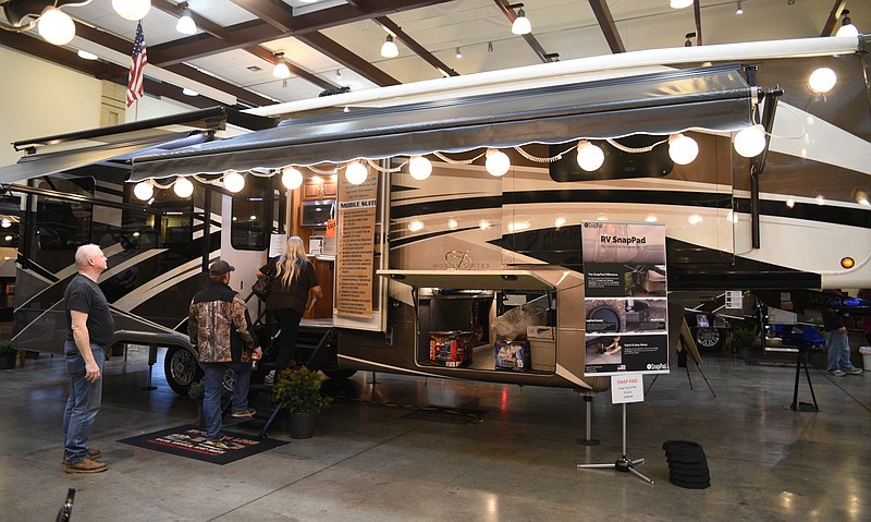 In this Sunday, Jan. 22, 2017, staff file photo, people look at RVs at the Chattanooga RV Show at the Chattanooga Convention Center.