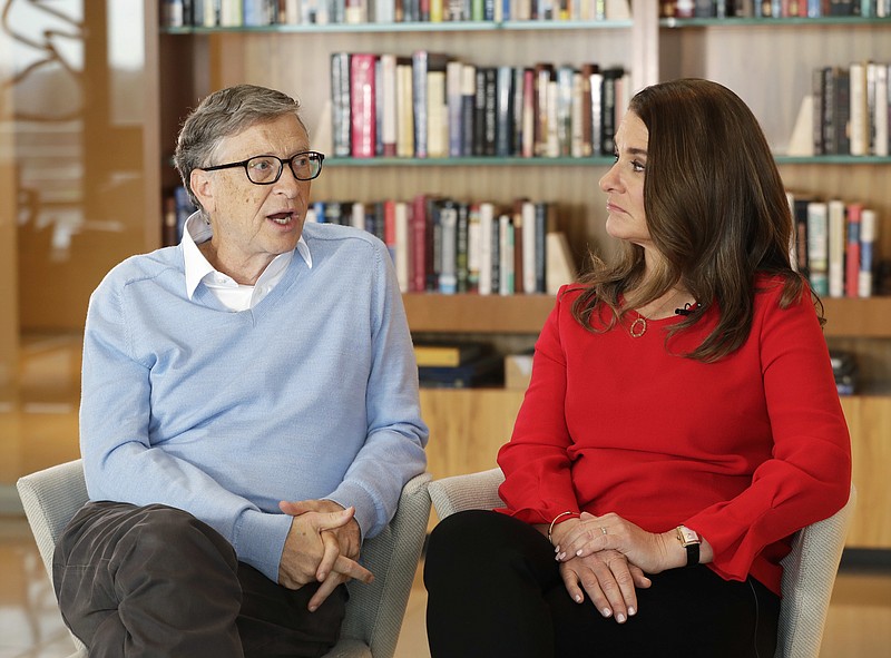 In this Feb. 1, 2018 photo, Microsoft co-founder Bill Gates and his wife Melinda take part in an interview with The Associated Press in Kirkland, Wash. Gates and his wife, head the Bill and Melinda Gates Foundation, are rethinking their work in America as they confront what they consider an unsatisfactory track record, the country's growing inequity and a president they disagree with more than any other. (AP Photo/Ted S. Warren)