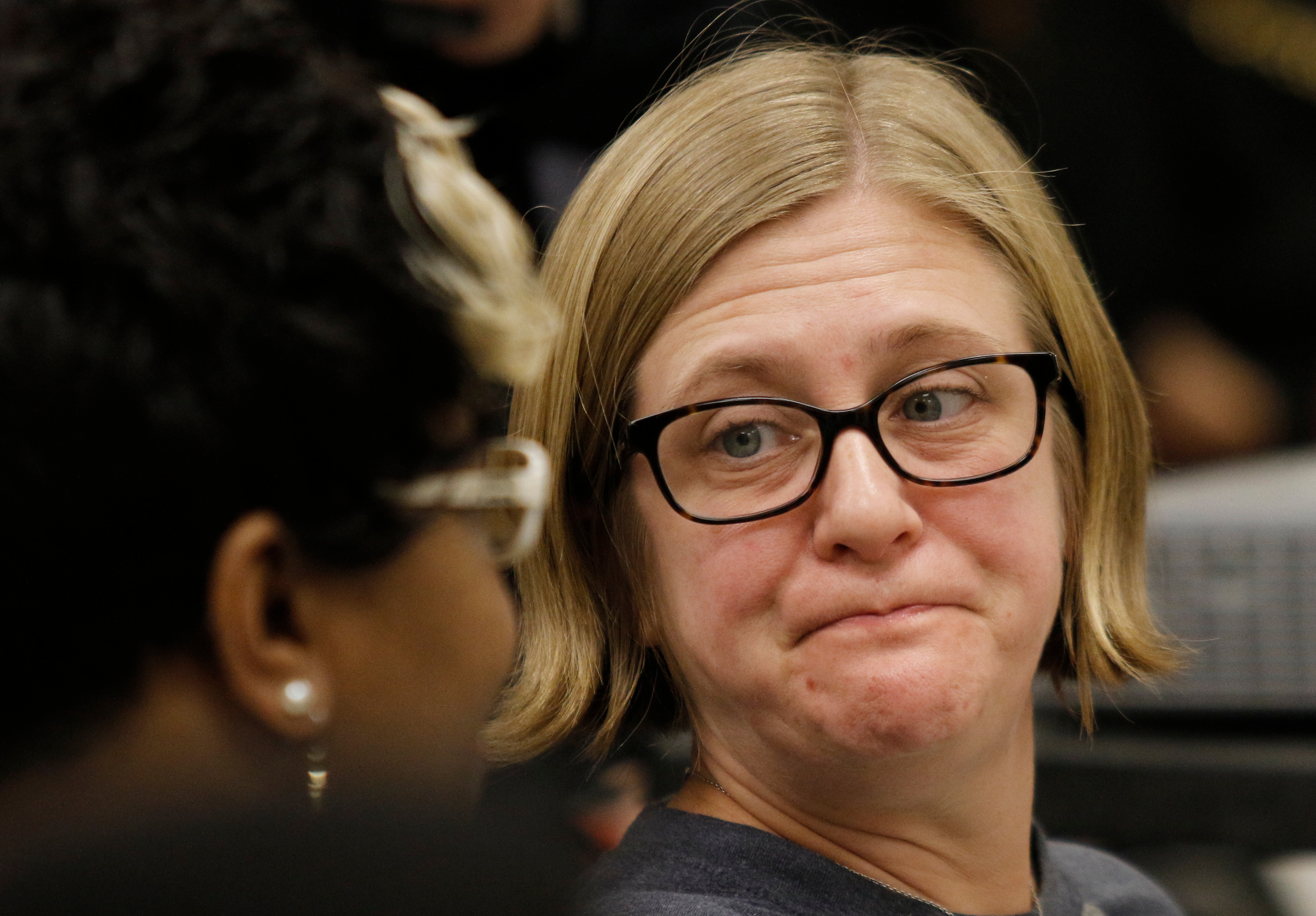 Jenn Lehman, who said the EPA did not test the soil at her Jefferson Heights home where she lives with two children, reacts to an answer to her question during a public meeting held by the Environmental Protection Agency at South Chattanooga Recreation Center on Tuesday, Feb. 13, 2018, in Chattanooga, Tenn. The EPA held the meeting to address community concerns about lead pollution in the Southside Chattanooga Lead Site, which includes the Alton Park and Jefferson Heights neighborhoods.