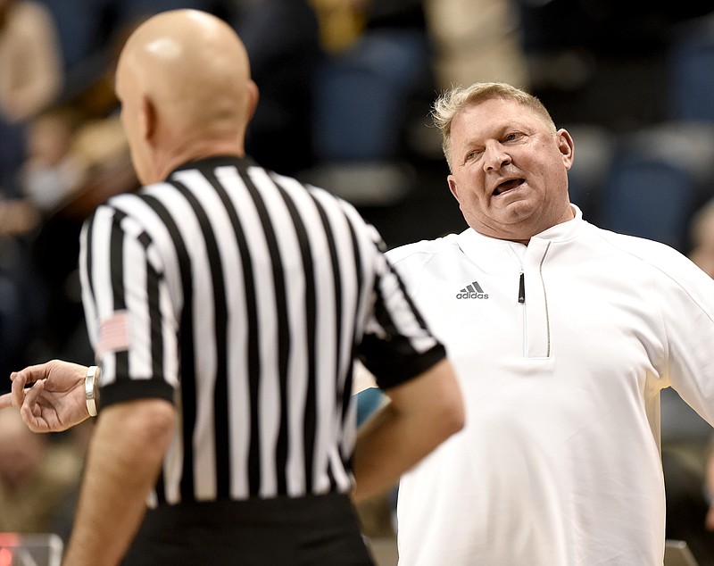 The Citadel's head coach Duggar Baucom disagrees with a official.  The Citadel Bulldogs visited the University of Tennessee Chattanooga Mocs in Southern Conference basketball action at McKenzie Arena in Chattanooga, Tennessee on February 8, 2018.  