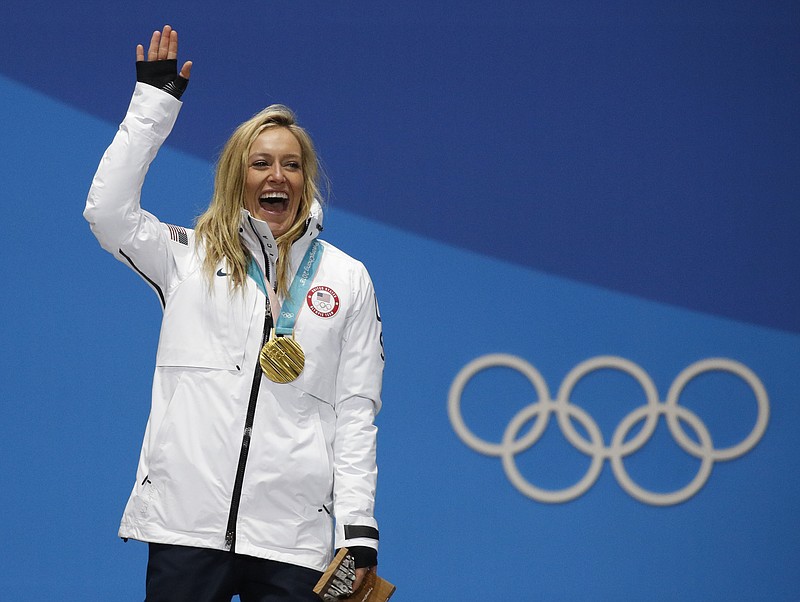 Women's slopestyle gold medalist Jamie Anderson, of the United States, smiles during the medals ceremony at the 2018 Winter Olympics in Pyeongchang, South Korea, Monday, Feb. 12, 2018. (AP Photo/Jae C. Hong)